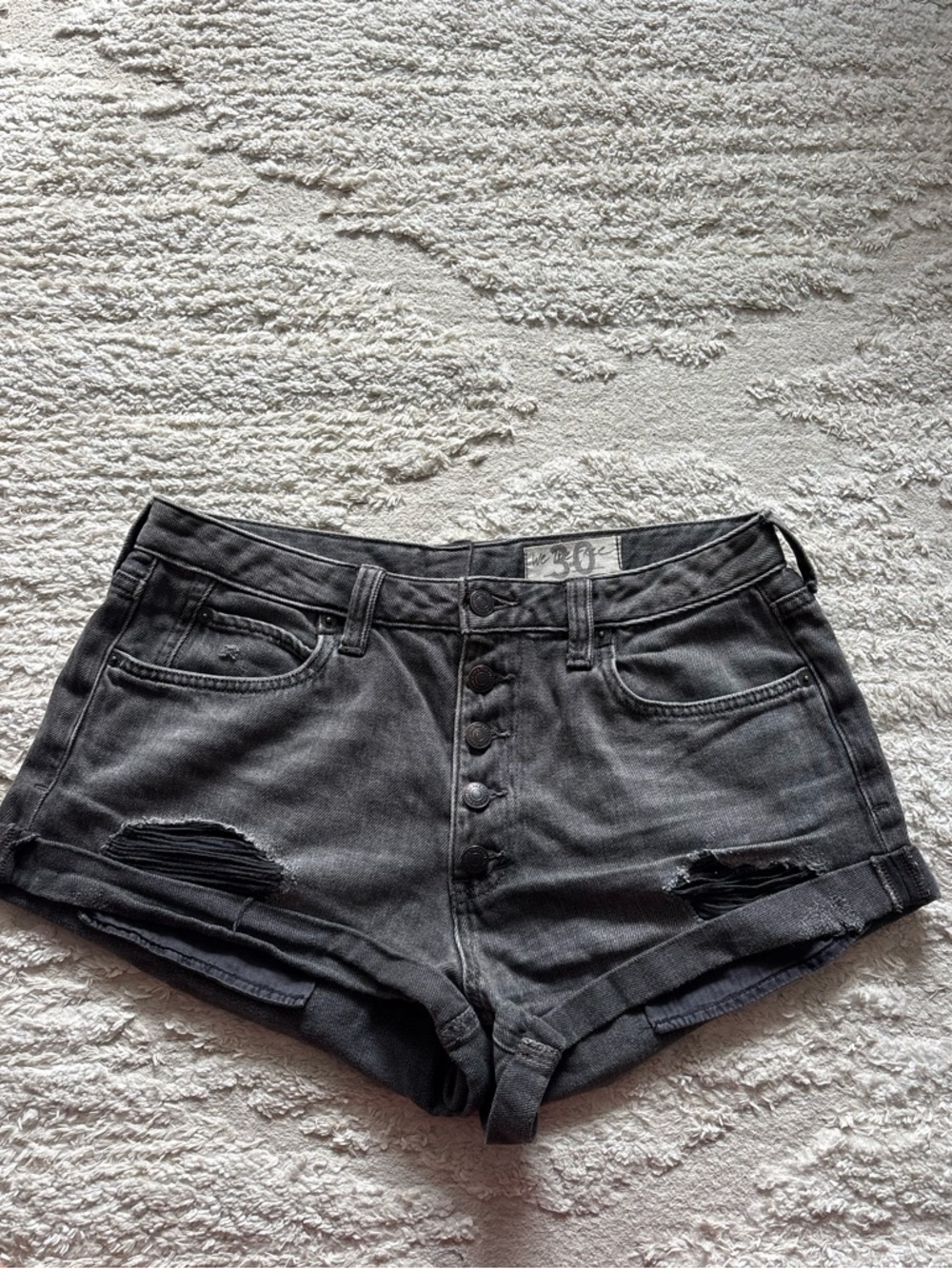 Free People Romeo Rolled Cutoff Denim Shorts in the color "Washed Black" Size 30